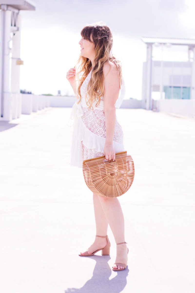 Miami fashion blogger Stephanie Pernas wearing a white lace dress