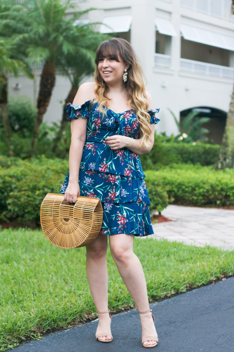 Miami fashion blogger Stephanie Pernas styles an off the shoulder floral dress and pearl earrings