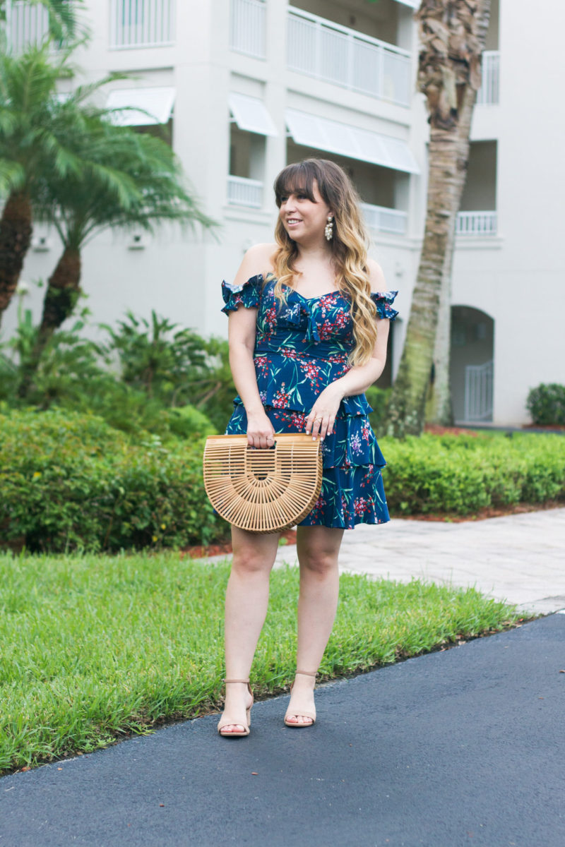 Miami fashion blogger Stephanie Pernas of A Sparkle Factor wearing a Wayf floral off the shoulder dress