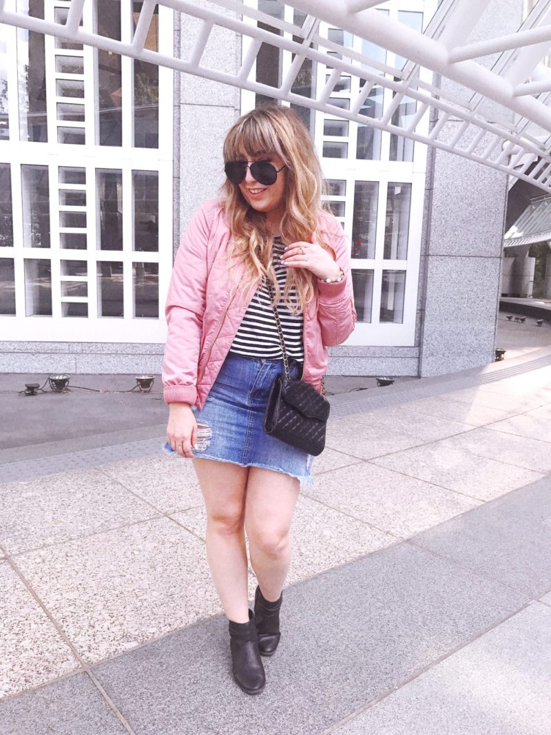 Pink bomber jacket and jean skirt outfit