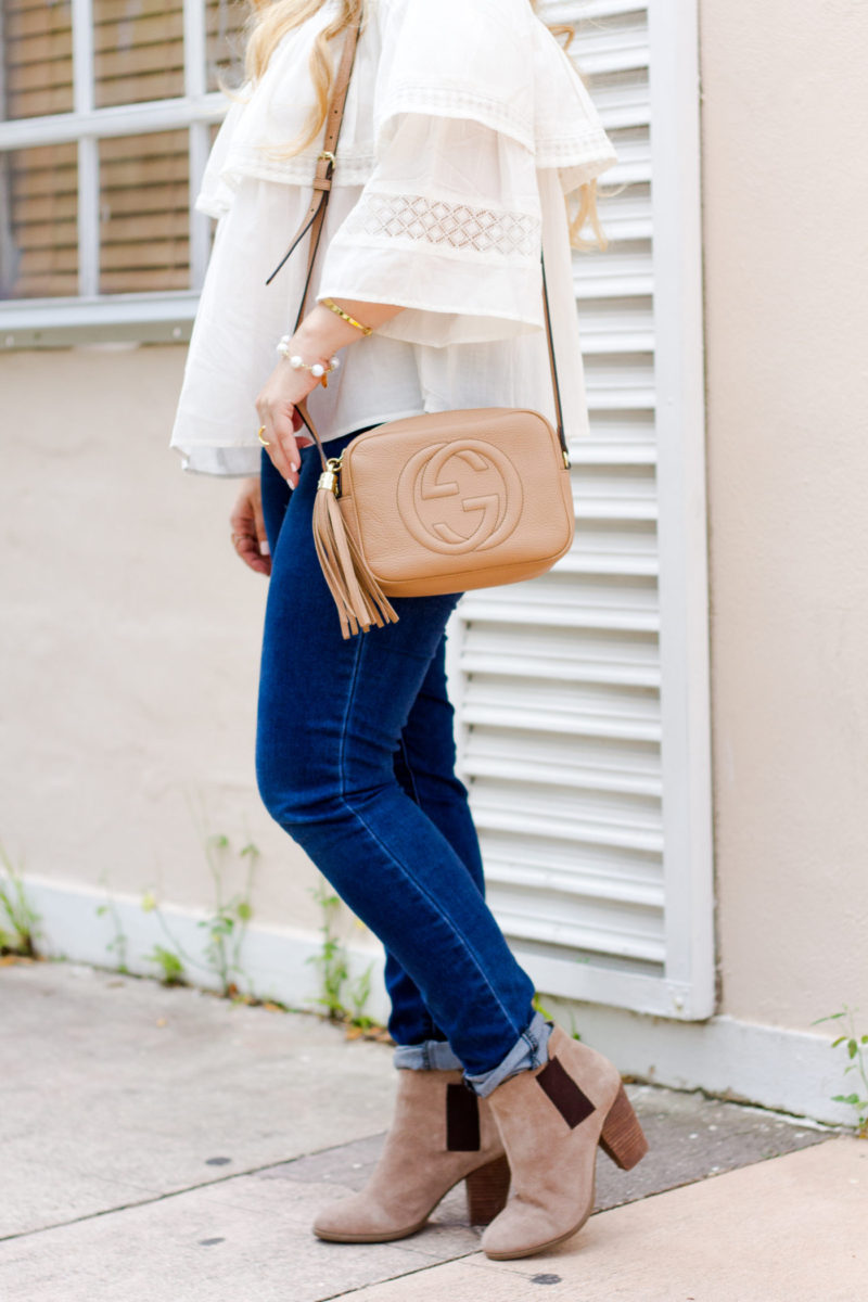 Miami fashion blogger Stephanie Pernas wearing jeans, booties and the Gucci Disco bag 