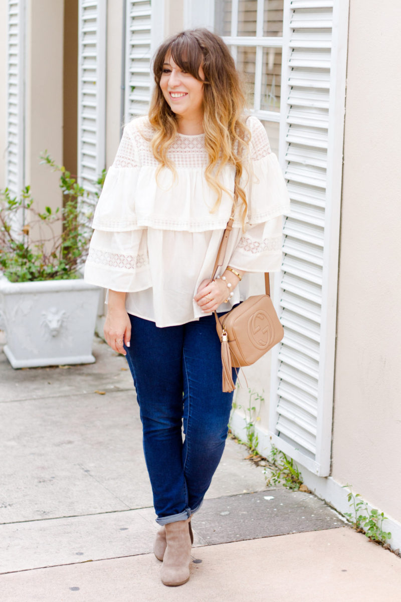 Affordable style blogger Stephanie Pernas wearing a ruffled top and skinny jeans for a casual fall outfit idea 