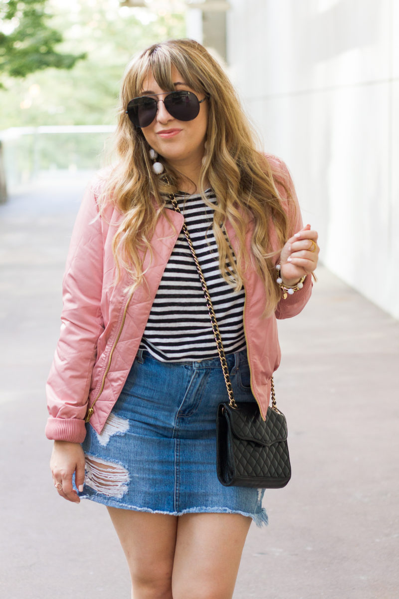 Miami fashion blogger Stephanie Pernas of A Sparkle Factor styles a pink bomber jacket outfit idea for fall.