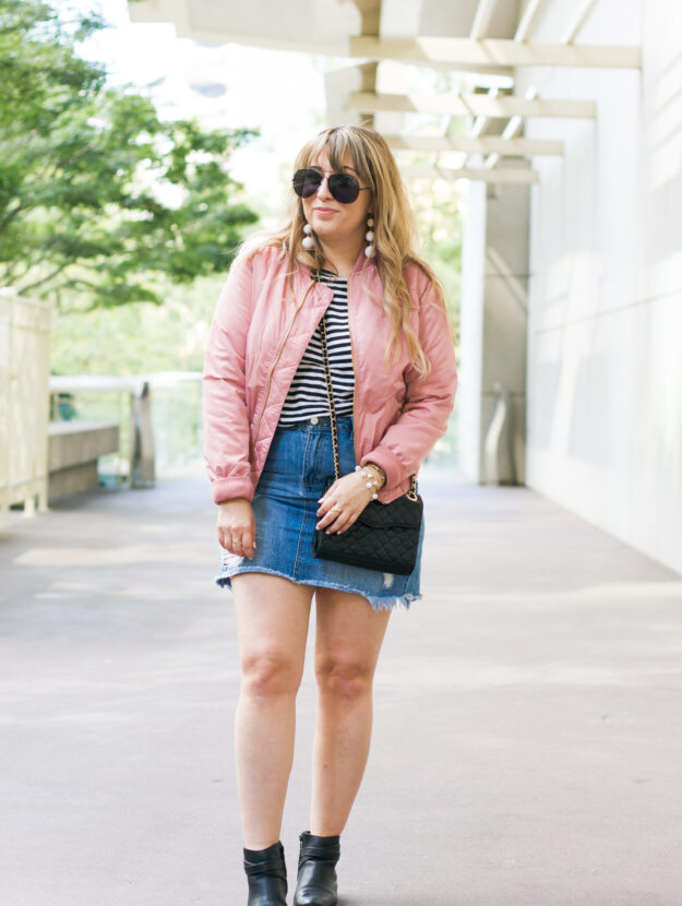 Pink bomber jacket and jean skirt outfit