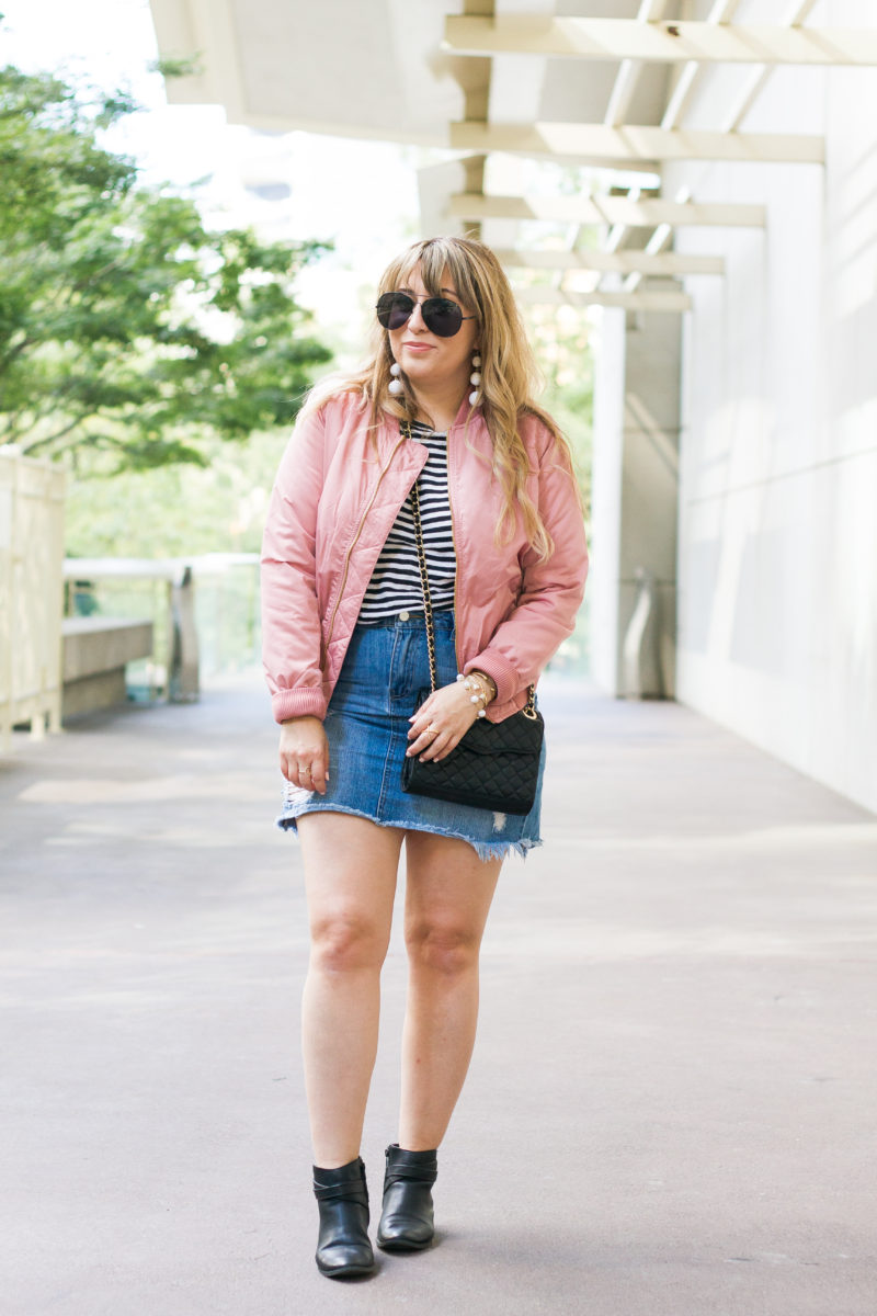 Pink bomber jacket and jean skirt outfit