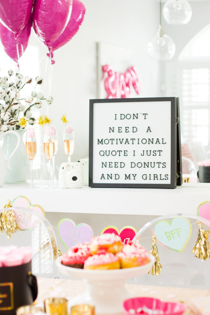 How to throw a Galentine's Day party: cute Galentine's Day party decor. Get a cute letterboard!