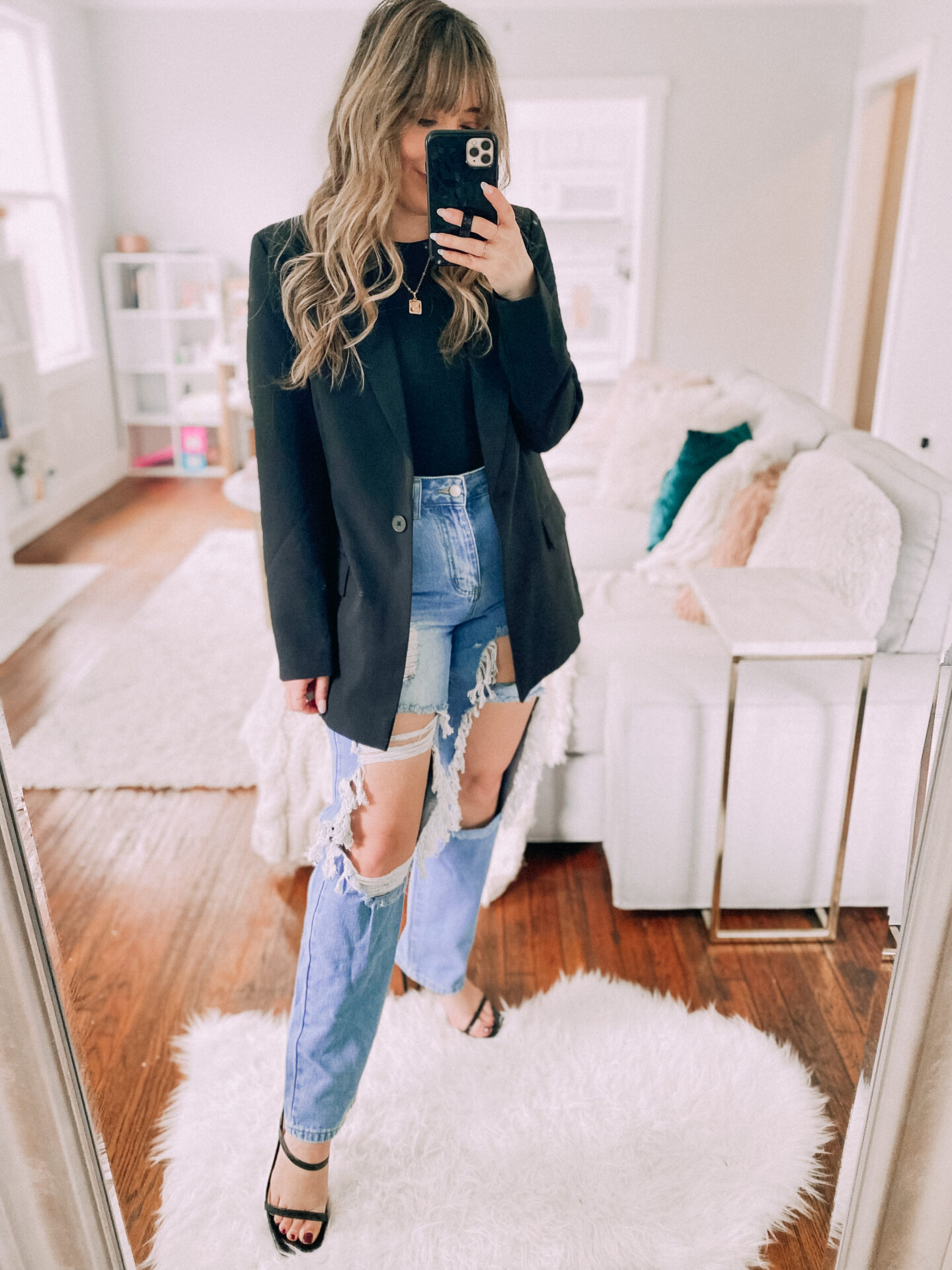 Bodysuit and jeans paired with an oversized blazer