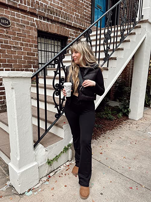 Influencer Stephanie Pernas wearing a black cropped puffer vest, black cropped turtleneck and black crossover yoga pants, all from Amazon